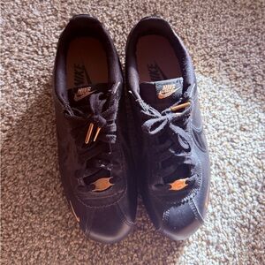 Nike Men’s Black Sneakers with Copper Accents